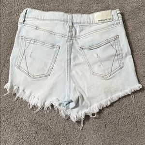 Kendall + Kylie icon denim light blue jean shorts with frayed edges